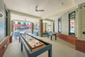Thumbnail 9 of 51 - Game Room With Shuffle Board at The Lincoln Apartments, Raleigh