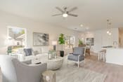 Thumbnail 7 of 40 - a white living room with a ceiling fan