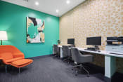 Thumbnail 10 of 58 - a office with a green wall and orange chairs and desks