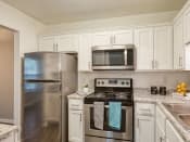 Thumbnail 7 of 38 - Stainless steel appliances in remodeled kitchen