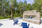Thumbnail 43 of 46 - Longleaf at St. Johns Apartments | St. Johns, FL | Outdoor Fireplace