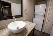 Thumbnail 9 of 18 - bathroom with vanity and stacked washer dryer