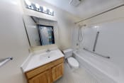 Thumbnail 3 of 17 - a bathroom with a sink toilet and bathtub