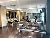 Thumbnail 16 of 29 - a spacious fitness center with treadmills and ellipticals