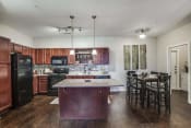 Thumbnail 7 of 18 - Kitchen with Island (most units come with an kitchen island)  at Overlook at Stone Oak Park Apartments, San Antonio, 78258