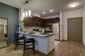 Thumbnail 17 of 32 - MODEL - Kitchen with Granite Counters & Stainless Steel Appliances