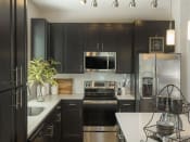 Thumbnail 51 of 78 - Updated Kitchen With Black Appliances at Pointe at Prosperity Village Apartment Rentals in Charlotte