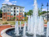 Thumbnail 14 of 78 - Lush Pointe at Prosperity Village Courtyards With Trickling Fountains in North Carolina Apartments for Rent