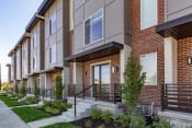 Thumbnail 2 of 30 - a row of townhomes with a sidewalk in front of them