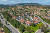 Thumbnail 43 of 48 - an aerial view of a neighborhood with red roofs and green grass at La Serena, San Diego, CA