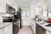 Thumbnail 6 of 39 - upgraded kitchen, quartz, new appliances at Bella Vista, Mission Viejo