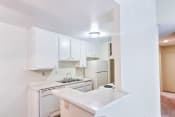 Thumbnail 20 of 23 - Village Park Apartments White Kitchen in Encinitas CA Now Leasing