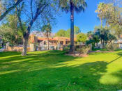 Thumbnail 6 of 22 - Community  filled with mature trees and lush landscaping at La Hacienda Apartments in Tucson, AZ!