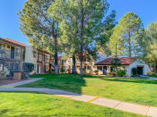 Thumbnail 4 of 22 - Community  filled with mature trees and lush landscaping at La Hacienda Apartments in Tucson, AZ!