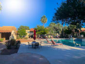 Thumbnail 16 of 22 - Sparkling pool and lounge area at La Hacienda Apartments in Tucson, AZ!