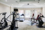 Thumbnail 21 of 24 - Montfort Place fitness center. Two treadmills, two cable machines, two cardio climber machines. one exercise bike. Montfort Place in North Dallas, TX, For Rent. Now leasing 1 and 2 bedroom apartments.