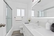 Thumbnail 7 of 23 - a white bathroom with a sink and a shower
