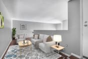 Thumbnail 5 of 33 - a living room with grey walls and a white couch