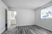 Thumbnail 6 of 44 - a bedroom with hardwood floors and white walls