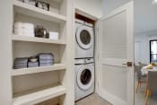 Thumbnail 30 of 38 - a washer and dryer in a laundry room