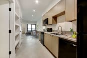 Thumbnail 2 of 38 - a kitchen and dining area in a 555 waverly unit