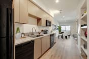 Thumbnail 9 of 38 - a kitchen and dining area in a 555 waverly unit
