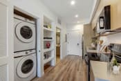 Thumbnail 10 of 38 - a laundry room with a washer and dryer