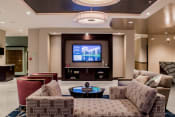 Thumbnail 3 of 41 - Spacious and luxurious lobby with a television and ample seating at Quarry at River North
