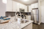 Thumbnail 1 of 41 - Marble Style Floorplan Kitchen at Quarry at River North