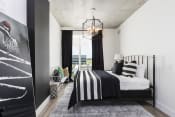 Thumbnail 30 of 42 - bedroom with large windows and modern chandelier at Lake Nona Pixon, Orlando, FL, 32827