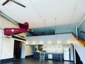 Thumbnail 12 of 24 - loft with contemporary kitchen, pendant lighting, and half an airplane on the wall at Jemison Flats, Alabama