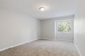 Thumbnail 50 of 70 - spacious carpeted bedroom with large window in apartment at The Onyx Hoover