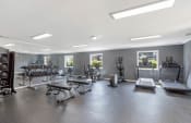Thumbnail 7 of 70 - the large fitness center with cardio, strength, and free weight equipment at The Onyx Hoover