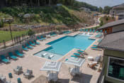 Thumbnail 14 of 24 - The large resort-style pool and sundeck at Canopy Park Apartments, Pelham Alabama