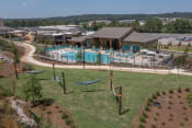 Thumbnail 11 of 24 - The hammock lounge and pool and sundeck at Canopy Park Apartments, Pelham, 35124