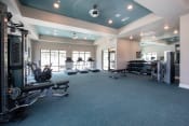 Thumbnail 8 of 24 - Canopy Park's massive fitness center with cardio and strength training equipment at Canopy Park Apartments, Pelham Alabama