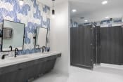 Thumbnail 9 of 48 - the clubhouse bathroom at Lake Nona Concorde with blue and white wall tiles