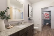 Thumbnail 41 of 48 - a bathroom with a toilet sink and mirror at Lake Nona Concorde
