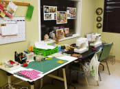 Thumbnail 11 of 18 - craft room with sewing machines and more at B'nai B'rith I, II, & III apartments in deerfield beach