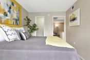 Thumbnail 24 of 32 - a bedroom with grey walls and yellow accents