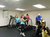 Thumbnail 16 of 18 - Residents enjoying the gym at B'nai B'rith I, II, III deerfield apartments in deerfield beach, FL