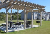 Thumbnail 11 of 18 - Pergola with picnic tables and grills