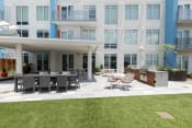 Thumbnail 35 of 42 - grilling patio with dining area on amenity deck at Lake Nona Pixon, Orlando, Florida