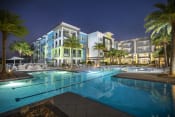 Thumbnail 2 of 44 - Luxury, resort-style, olympic-sized pool at night at Residences at The Green Apartments for rent