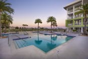 Thumbnail 18 of 44 - The large, tranquil pool at Residences at The Green at dusk