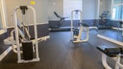 Thumbnail 11 of 11 - Fitness center with mirrored wall and weight machines