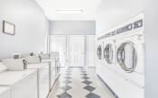 Thumbnail 10 of 25 - Laundry Facilities with Washers and Dryers