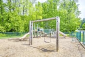 Thumbnail 7 of 25 - Fenced in Wooden Playground with Swing Set on Mulch