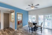 Thumbnail 7 of 24 - Clubhouse Interior with blue accent wall, ceiling fan, and hardwood style flooring