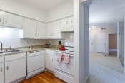 Thumbnail 10 of 24 - Kitchen with White Appliances and White Cabinetry